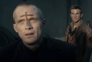 Priest (Paul Bettany) appears with a cross on his forehead in Priest (2011).