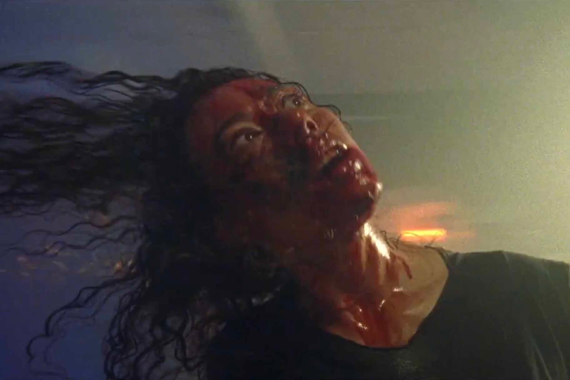 Dezzy (Dora Madison Burge) is covered in blood in Bliss (2019).