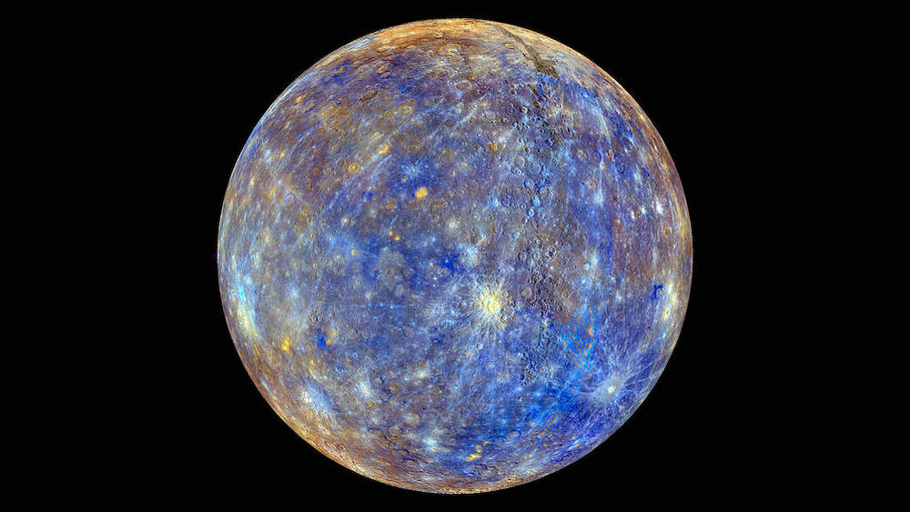 An image of Mercury that represents chemical, mineralogical, and physical differences between the rocks that make up Mercury's surface with colors spanning between blue, brown, and yellow.