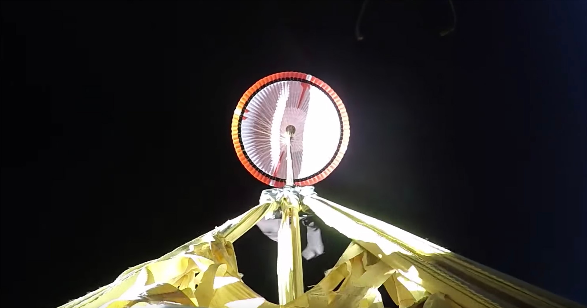 A huge parachute deploys at supersonic speeds above Earth in a test for the Mars 2020 landing. Credit: NASA / JPL