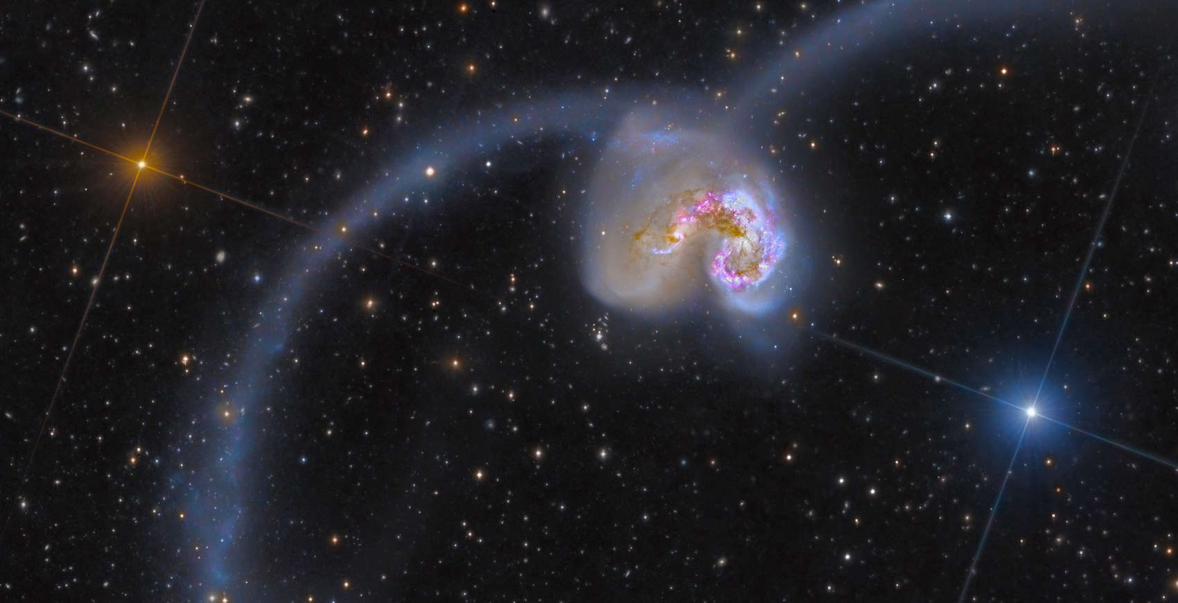 The Antennae Galaxies, a pair of colliding spiral galaxies 45 million light years away. Credit: NASA/ESA/ESO/NAOJ, Rolf Olsen and Federico Pelliccia