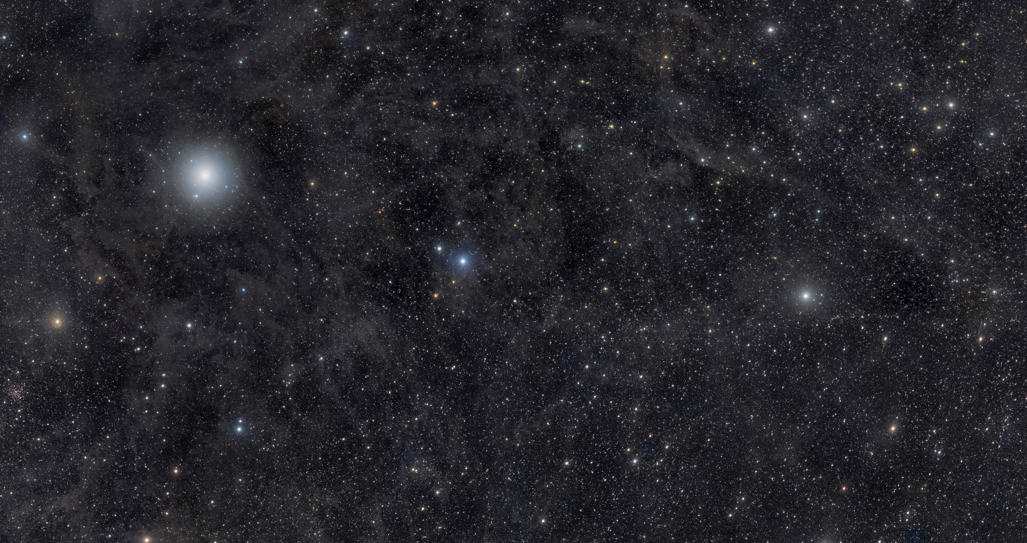 Ursa Minor — the Little Dipper — is gorgeous in this deep mosaic that shows thousands of stars, faint wisps of dust, and a brief interplanetary visitor. Credit: Rogelio Bernal Andreo
