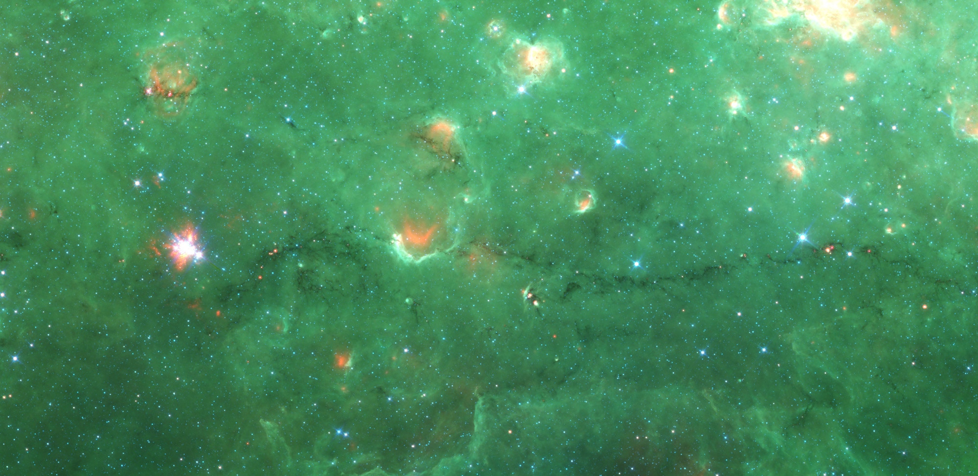"Nessie", the dark filament running along the bottom 1/3 of this image, is an immense cloud of cold gas and dust. Credit: NASA/JPL/SSC