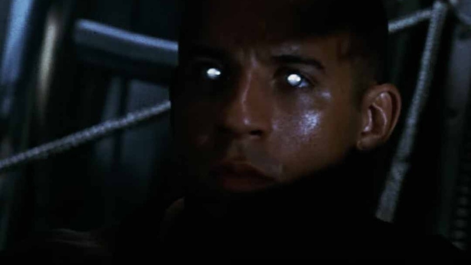 Riddick (Vin Diesel)'s eyes glow white in the dark in Pitch Black (2000).