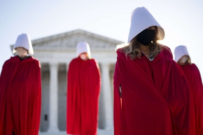 Women in Handmaids Tale robes protest Amy Coney Barrett at Supreme Court