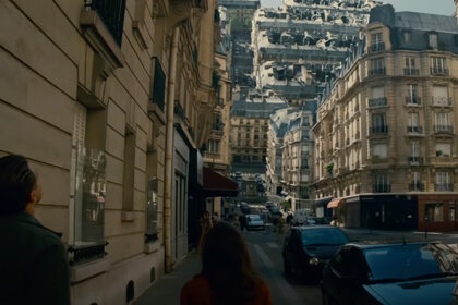 The world warps as two people watch in Inception (2010).