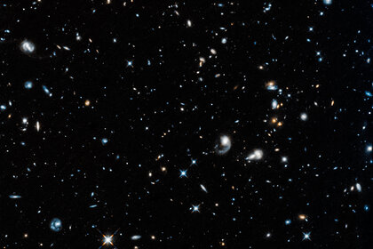 Distant galaxies pepper this deep infrared image of the sky, the first taken by Hubble after being reactivated after several weeks of being in safe mode due to a busted gyro. This image has been enlarged and slightly contrast-enhanced from original.