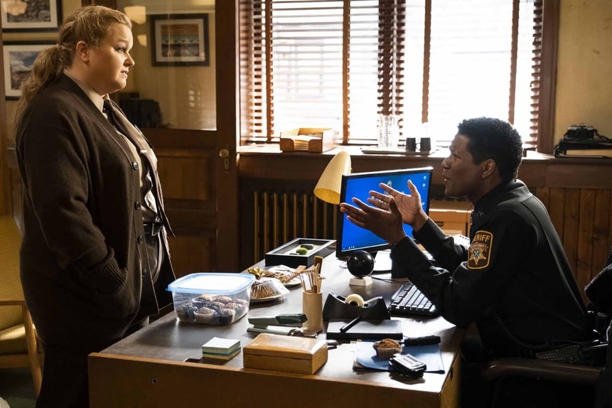 Deputy Liv Bake and Sheriff Mike Thompson speak over a desk in Resident Alien Episode 302.