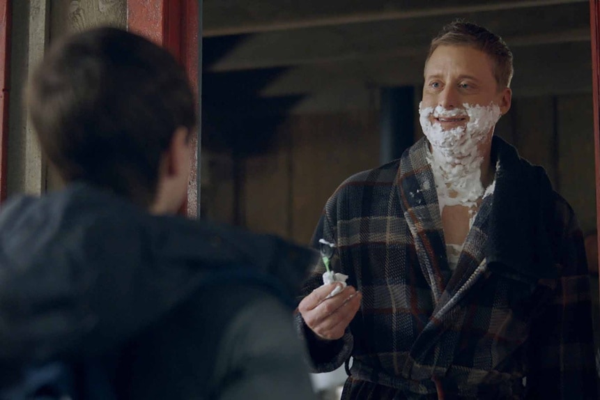 Harry Vanderspeigle appears in a doorway with shaving cream and a razor in Resident Alien Episode 302.