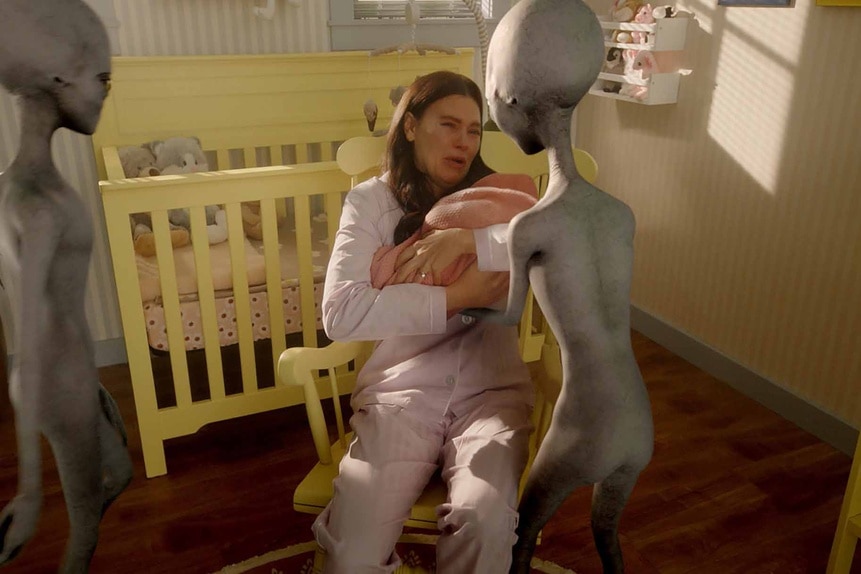 Kate Hawthorne cries as an Alien takes her baby away in Resident Alien Episode 303.
