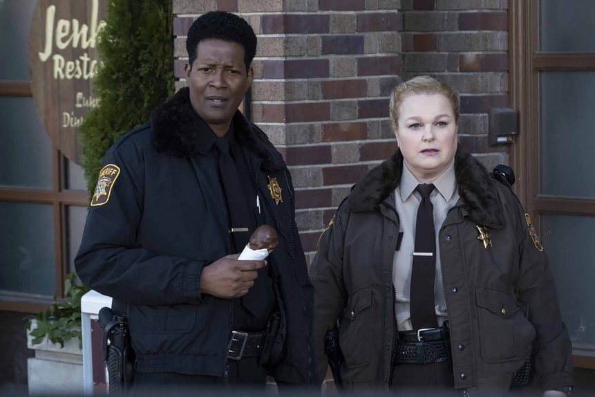 Sheriff Mike Thompson and Deputy Liv Bake stand outside in Resident Alien Episode 305.