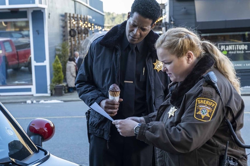 Sheriff Mike Thompson holds an ice cream cone and Deputy Liv Bake reads a letter in Resident Alien Episode 305.