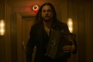 Frankie (Ben Robson) walks with a briefcase in The Continental: From the World of John Wick.