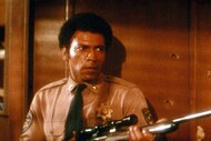 Ethan Bishop (Austin Stoker) holds a gun in Assault on Precinct 13 (1976).