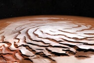 An oblique view of the Martian north polar cap using images from Mars Express combined with laser altimeter data to artificially change the perspective. The spiral trough pattern is obvious. Credit: ESA/DLR/FU Berlin, NASA MGS MOLA Science Team