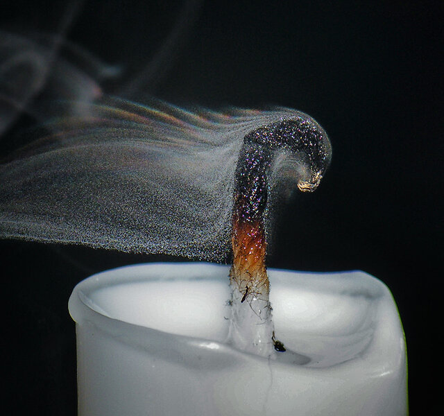 A slightly different airflow over the wick produces different patterns in the smoke and iridescent colors. Credit: Grover Schrayer