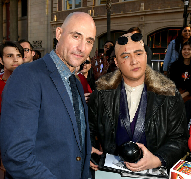 Mark Strong poses with a Sivana fan on the Shazam! red carpet