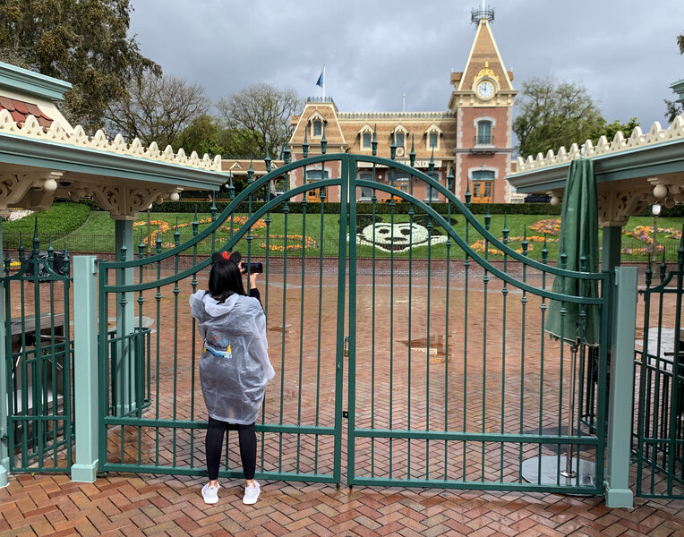 Visitor outside closed Disneyland gate via Getty Images