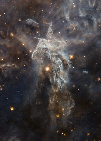 A star-forming nebula in Carina carved into a huge tower by massive stars. Credit: NASA, ESA, M. Livio and the Hubble 20th Anniversary Team (STScI), and Judy Schmidt