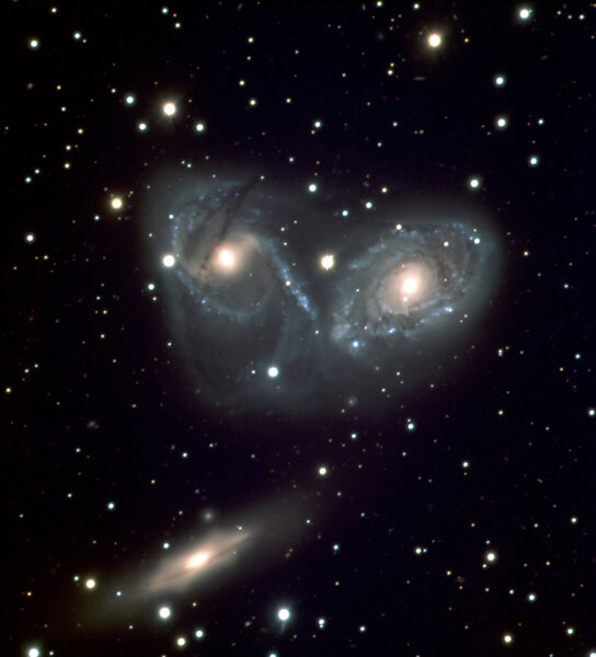 NGC 6769 (right) and NGC 6770 (left) are joined by a third galaxy, NGC 6771 (lower left) in this image taken by the Very Large Telescope. Credit: ESO