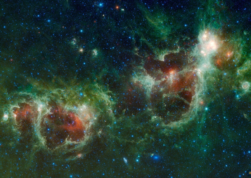 The Heart and Soul nebulae (W5, left, and W4, right) as well as NGC 896 (upper right) seen in the far infrared by the WISE observatory. Credit: NASA/JPL-Caltech/WISE Team