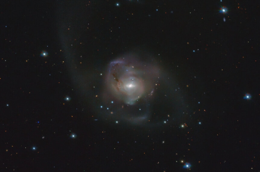 NGC 7727 is a spiral galaxy undergoing a merger