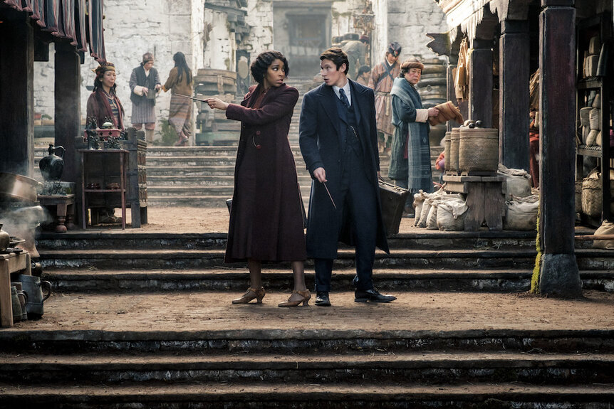 (L-R) JESSICA WILLIAMS as Eulalie “Lally” Hicks and CALLUM TURNER as Theseus Scamander