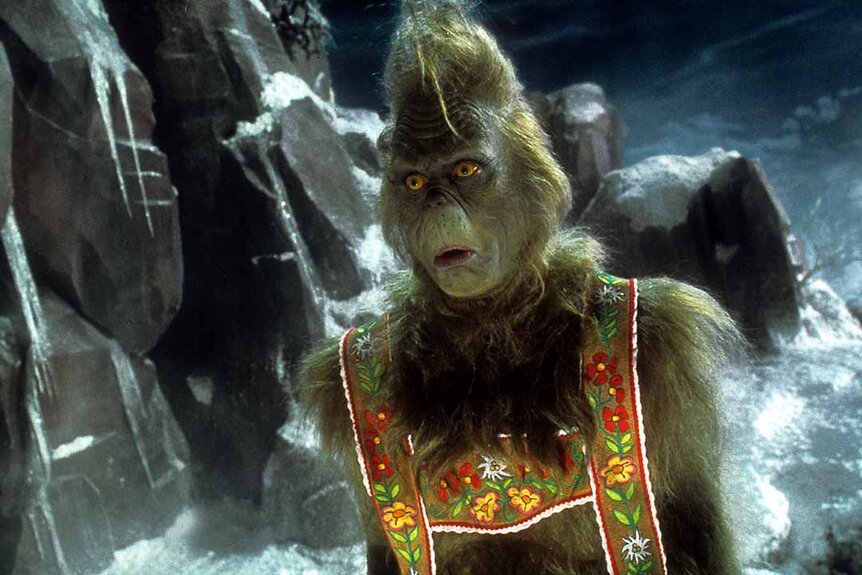 The Grinch (Jim Carrey) wears lederhosen in How the Grinch Stole Christmas (2000).