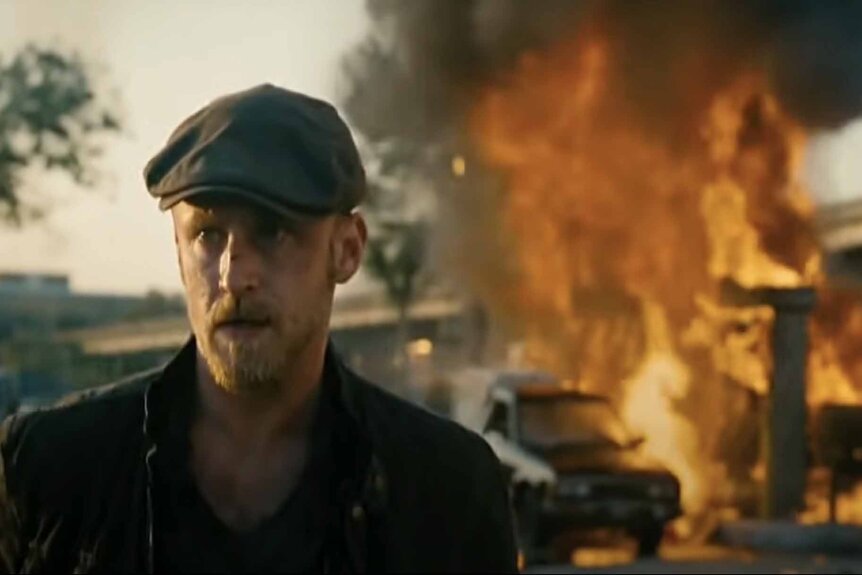 Ben Foster walks away from an explosion in The Mechanic (2011).