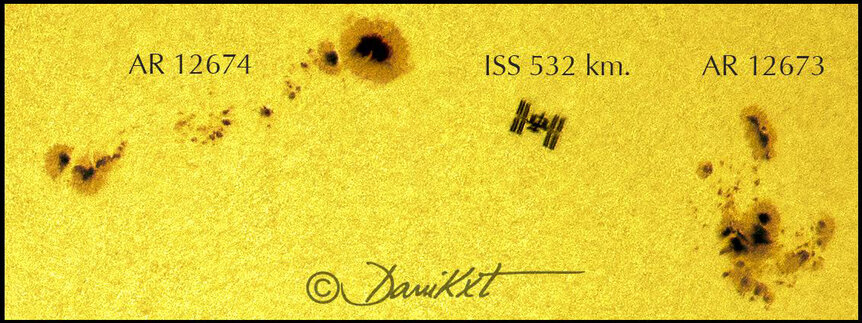 Close-up of the ISS transiting the Sun between two huge sunspot groups. Credit: Dani Caxete