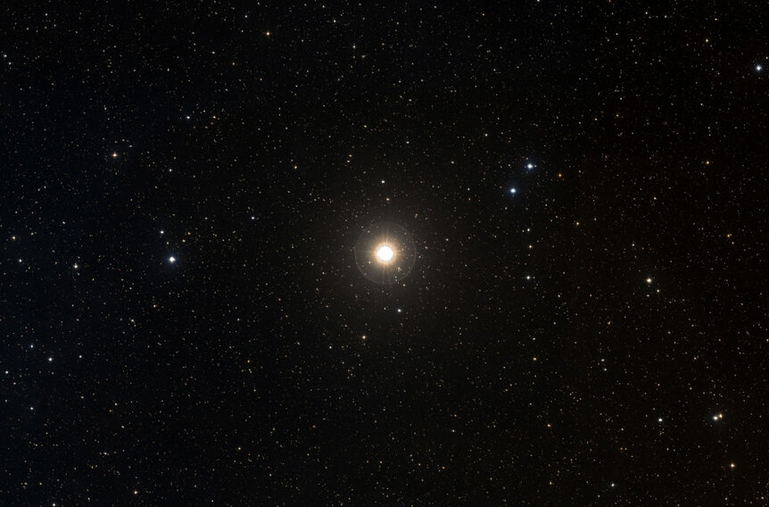 The bright star Gamma Cephei (actually a very close binary star), host to the very first confirmed exoplanet discovered. Credit: ALADIN / Digitized Sky Survey