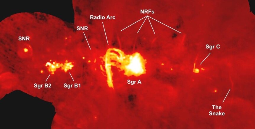 A combination of radios images from the VLA and Green Bank Telescopes show the galactic center and the curved arcs of gas around the Arches Cluster (labeled “radio arc”), as well as a few other features. Credit: NRAO/AUI/NSF Yusef-Zadeh, et al.