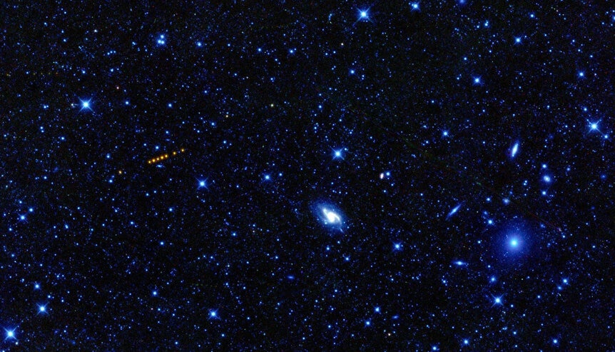 The asteroid Santa glows red in the image from NASA's WISE observatory.