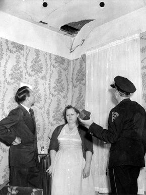A fist-sized meteorite (held by the man, right) broke through the roof of a house and struck Anne Hodges (middle) in 1954. Credit: University of Alabama Museums