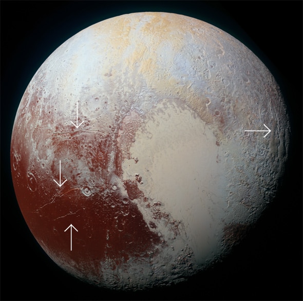 Arrows indicate huge cracks in Pluto's surface, possibly due to a liquid water ocean under the surface causing expansion. Credit: NASA/JHUAPL/SwRI