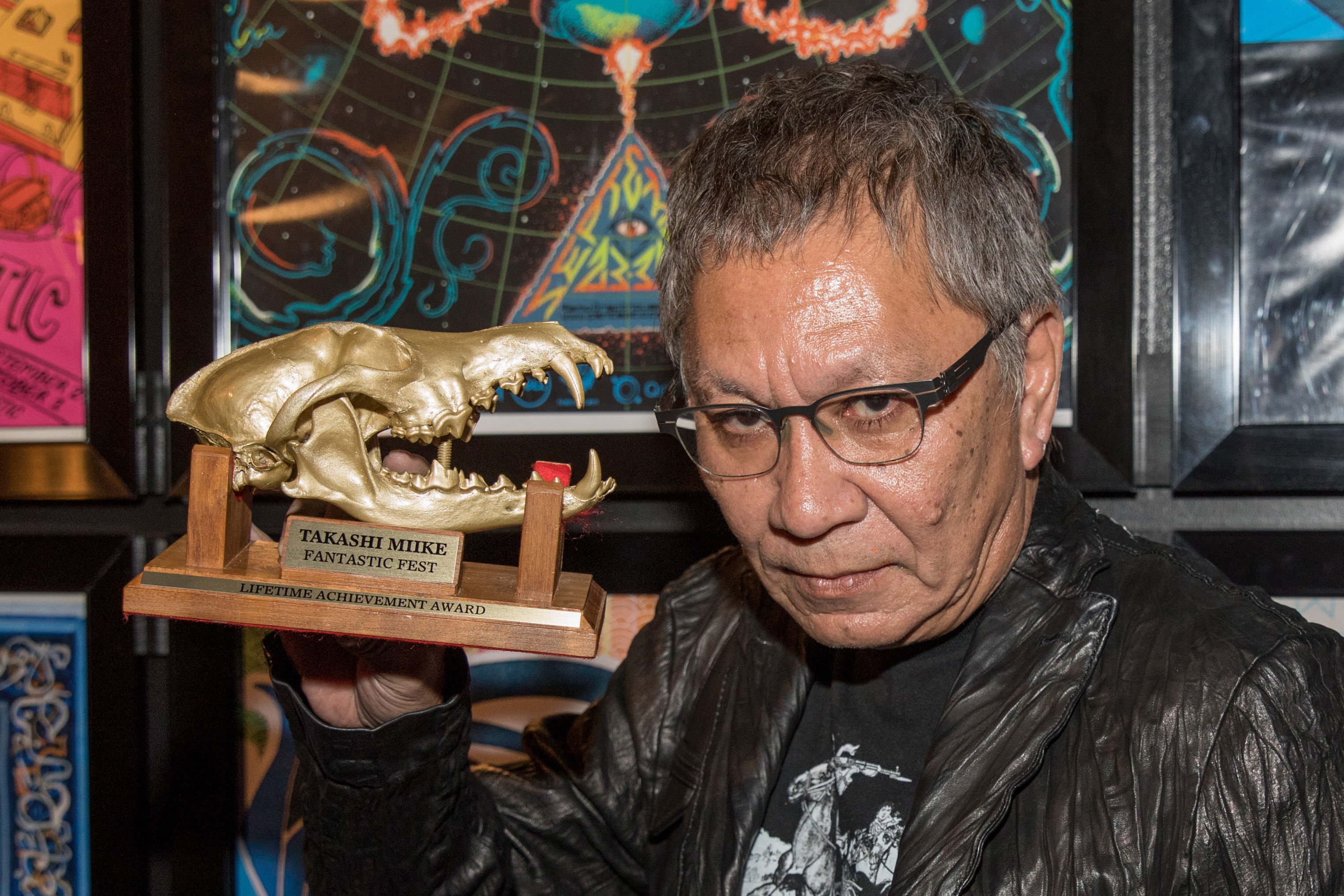 Director Takashi Miike poses with his Fantastic Fest Lifetime Achievement Award