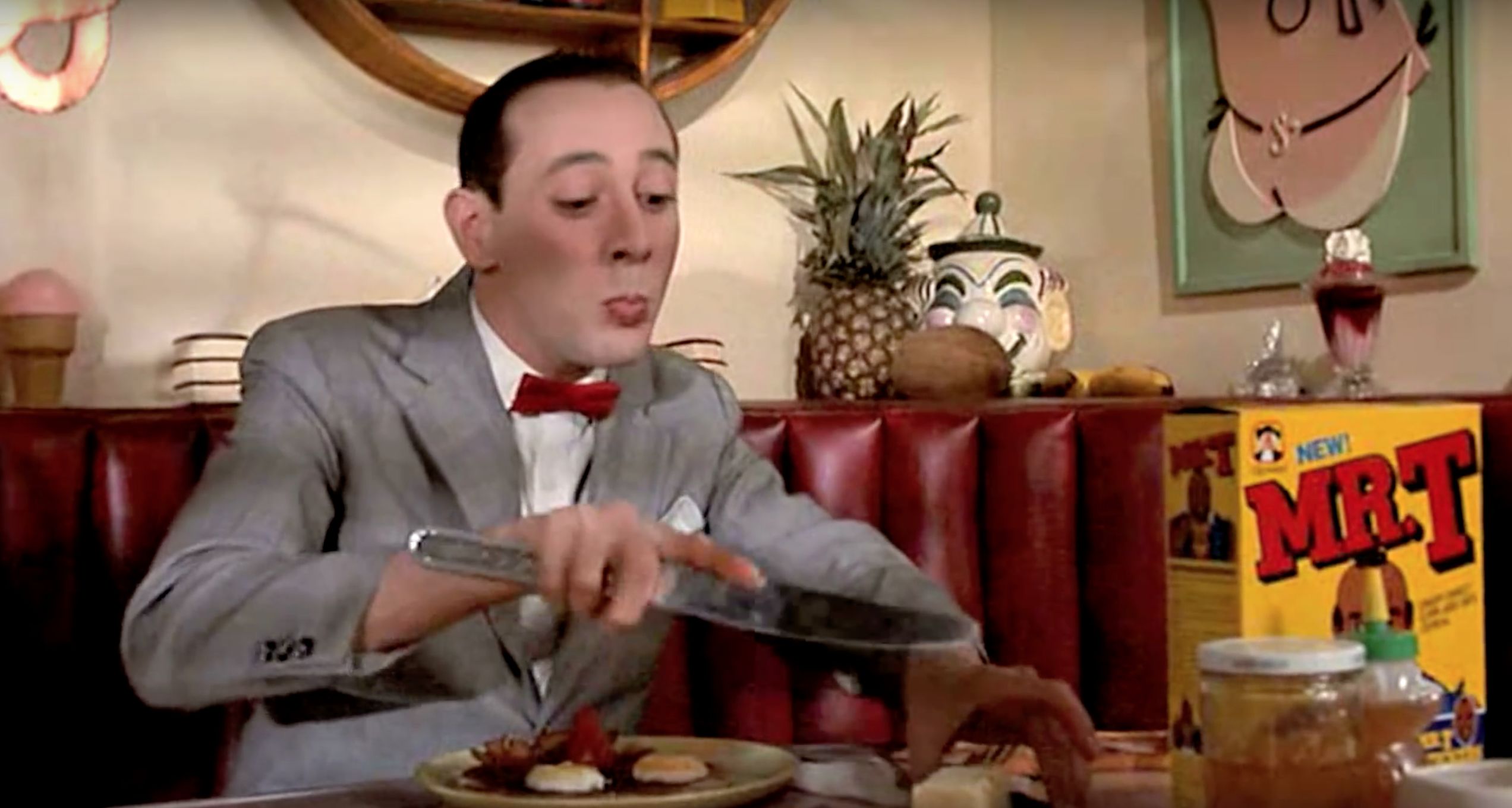Pee-wee Herman eats breakfast (Pee-wee's Big Adventure)