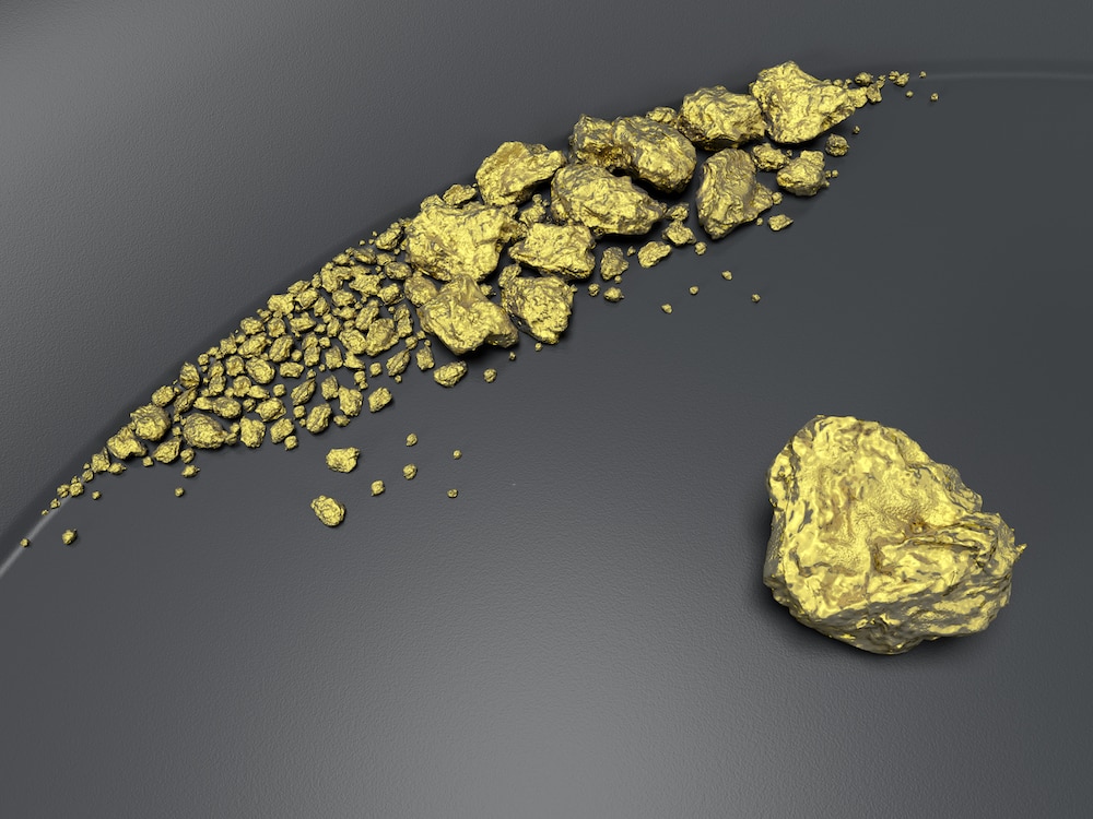 3D render of gold nuggets in a gold panning pan.