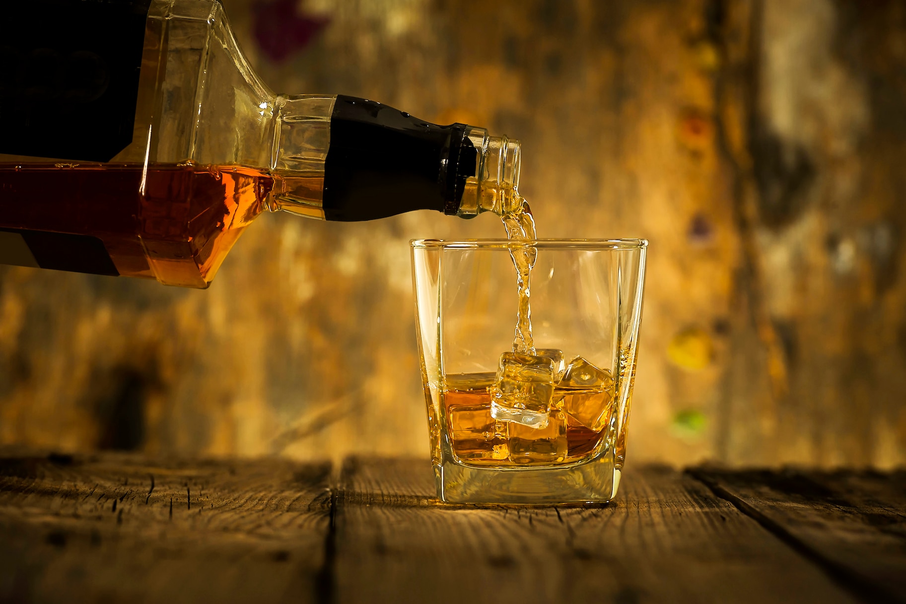 Barman pouring whiskey