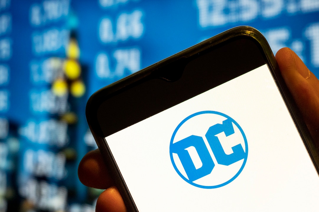 DC Comics logo displayed on a smartphone screen.