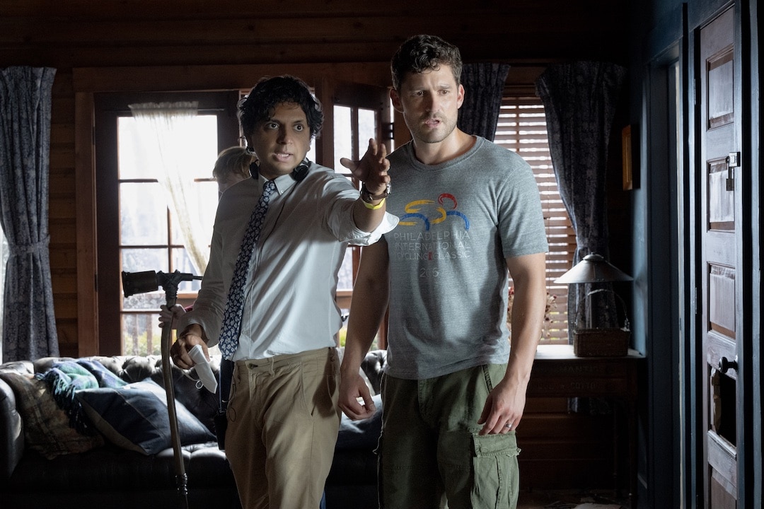 (from left) Director M. Night Shyamalan and Ben Aldridge on the set of Knock at the Cabin.