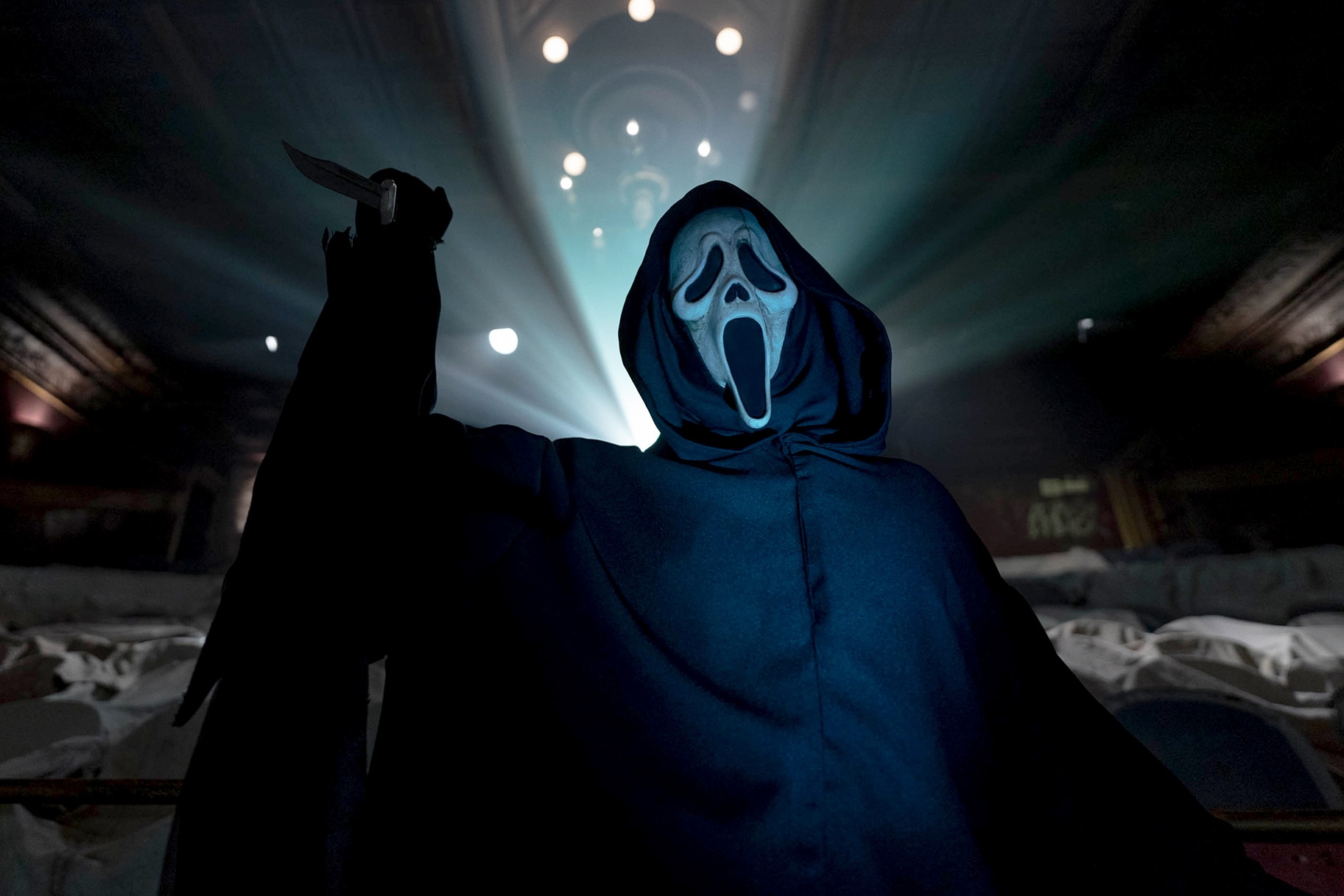 Ghostface holds a knife up in Scream Vi