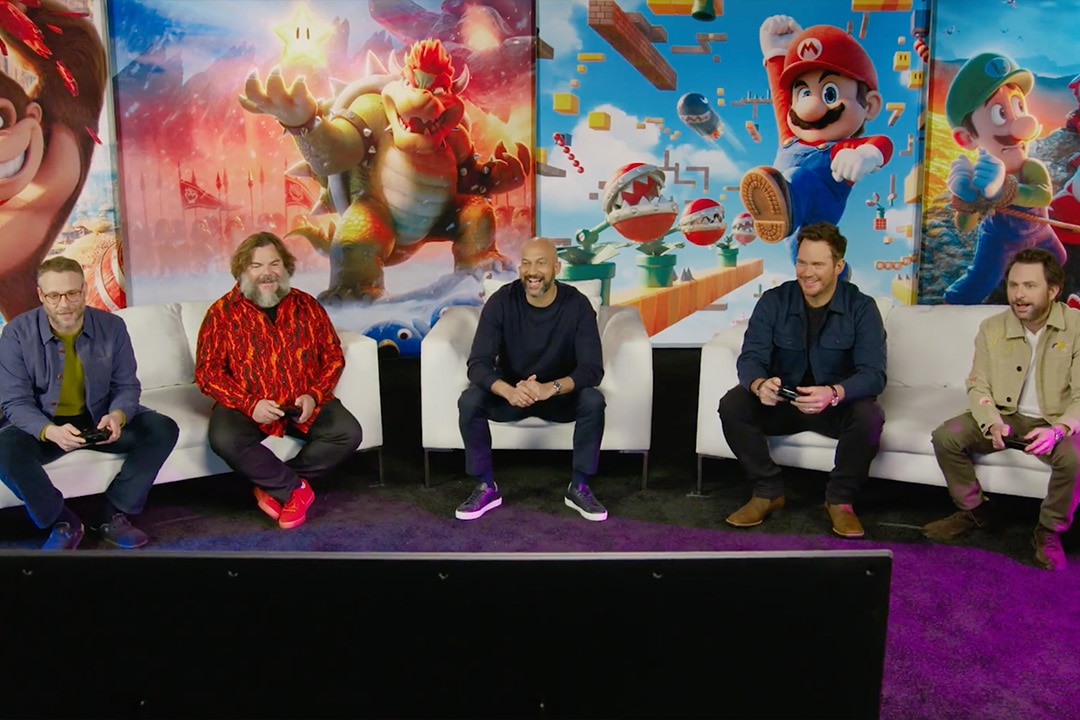 The cast of The Super Mario Bros. Movie (2023) playing Mario Kart
