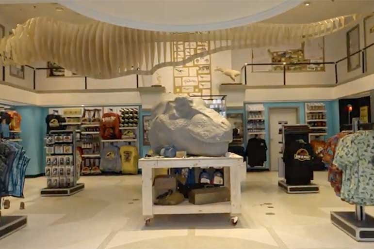 General views of the Jurassic Park 30th Anniversary Tribute store with a tyrannosaurus rex skull in the center