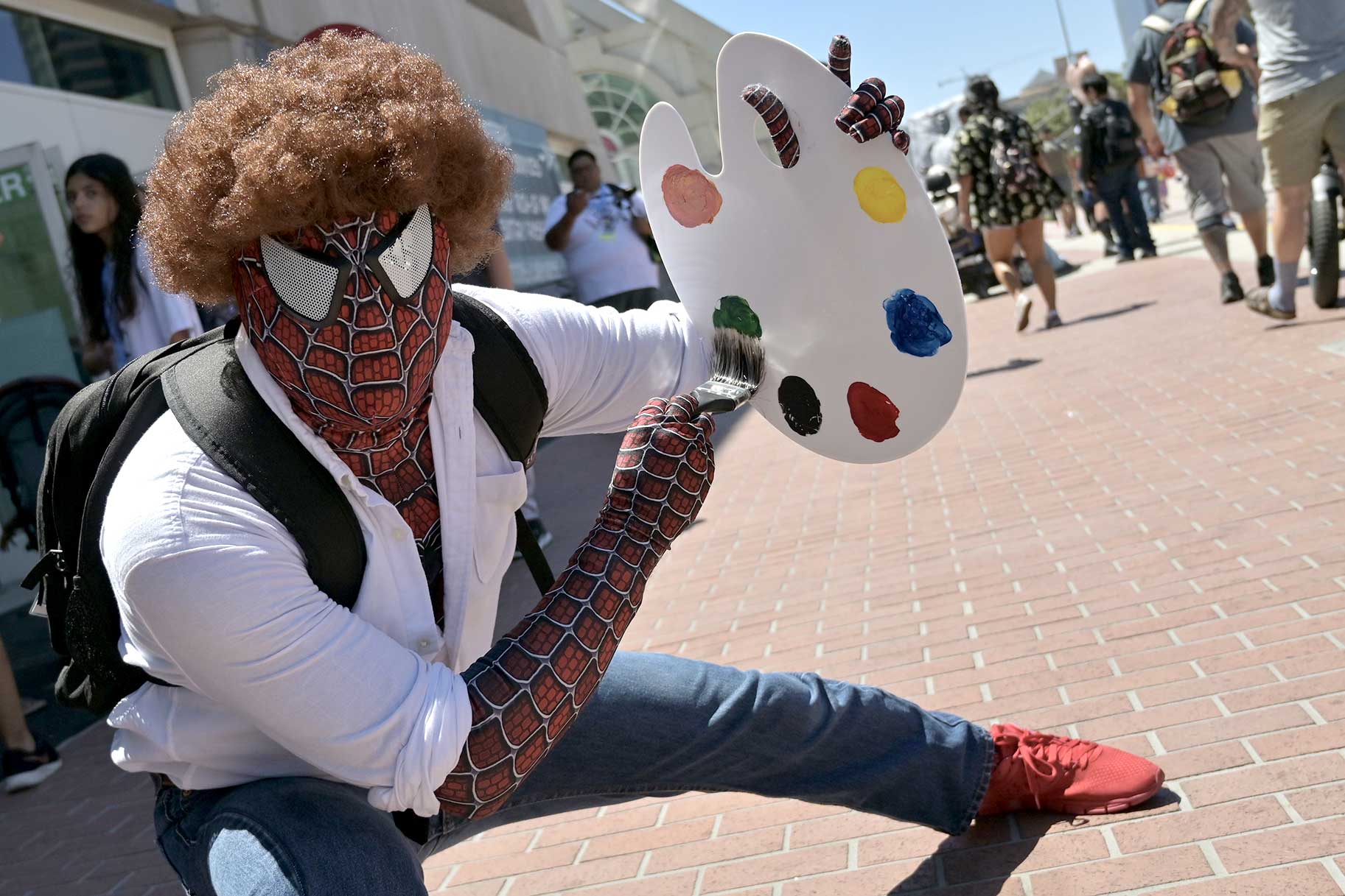 A cosplayer dressed as mash-up of Bob Ross and Spider-Man at San Diego Comic-Con 2023 Day 3