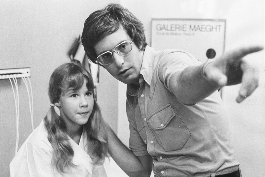 Linda Blair and William Friedkin on set of The Exorcist (1973).