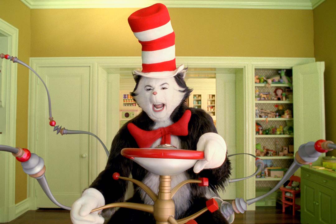 The Cat in the Hat (Mike Myers) rides a wacky contraption with protruding "arms" through The Waldens' house in The Cat in the Hat (2003).