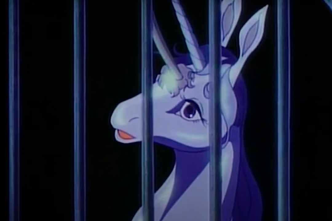 A scared unicorn appears in a cage in The Last Unicorn (1982)