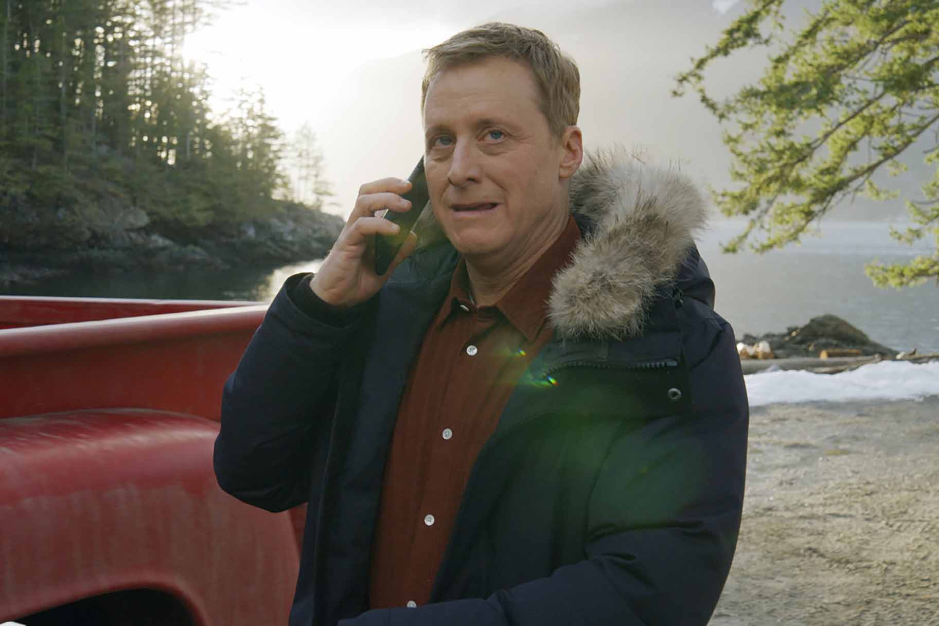Harry Vanderspeigle speaks on a cellphone in Resident Alien Episode 302.