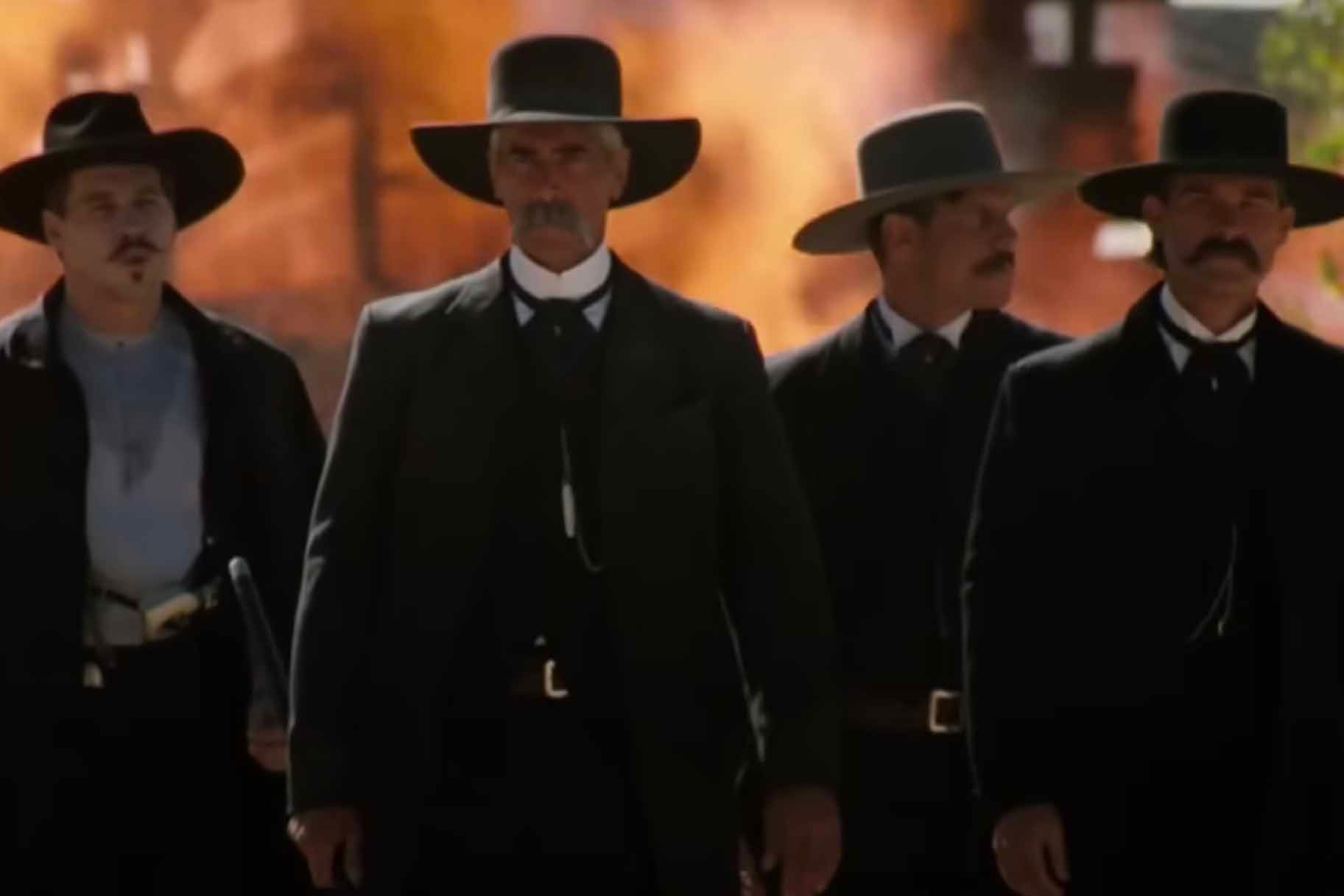 Doc Holliday and the Earp brothers walk together in Tombstone (1993).